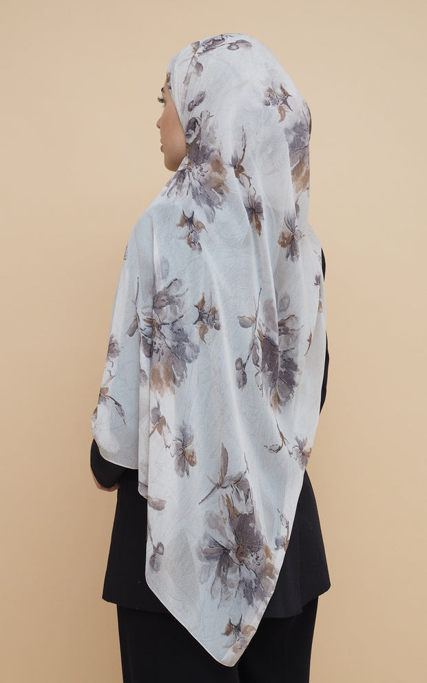 Woman wearing printed chiffon hijab with grayish brown flowers